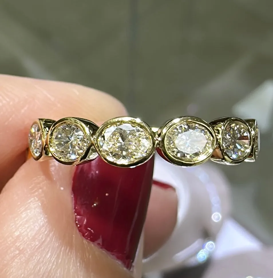 0.97ct tw Oval Cut Diamond Bezel Set Eternity Band