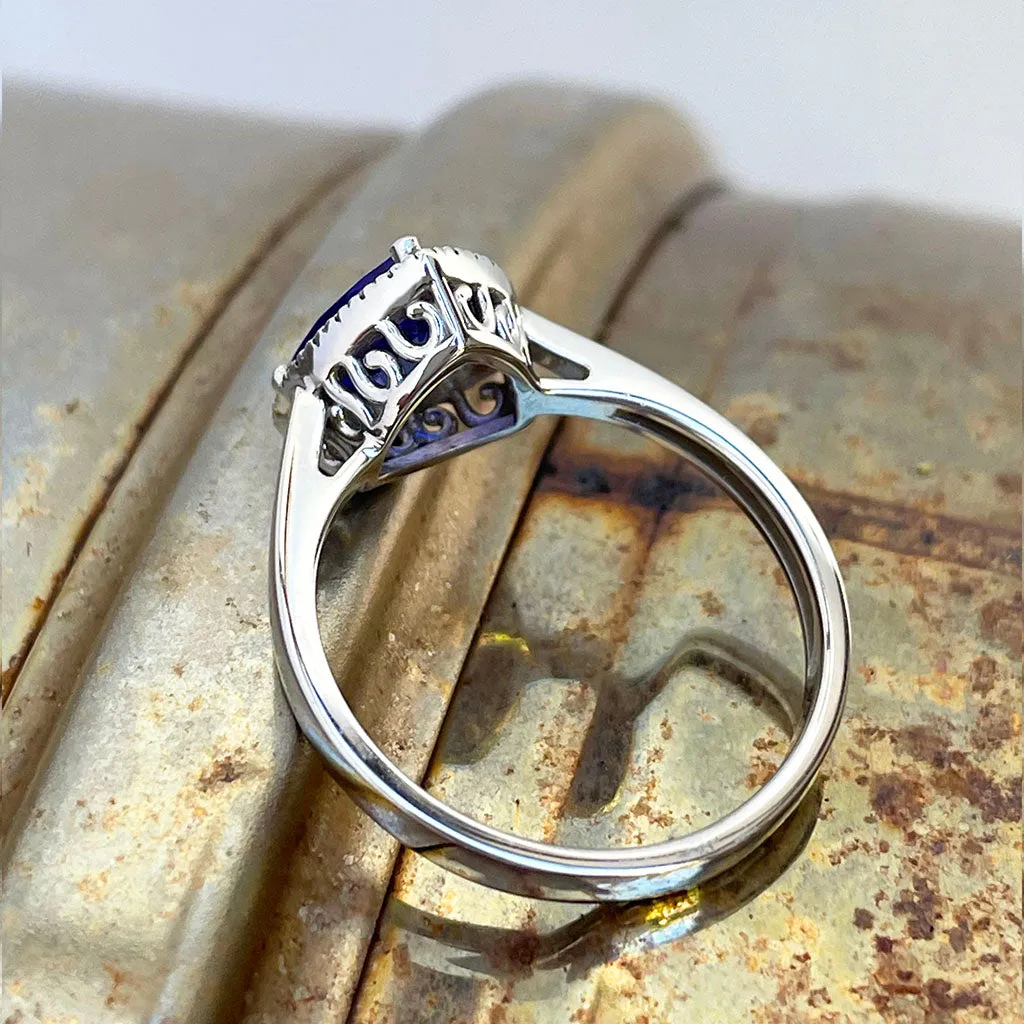 Tantalizing Trilliant Cut Tanzanite With Diamond Halo Ring