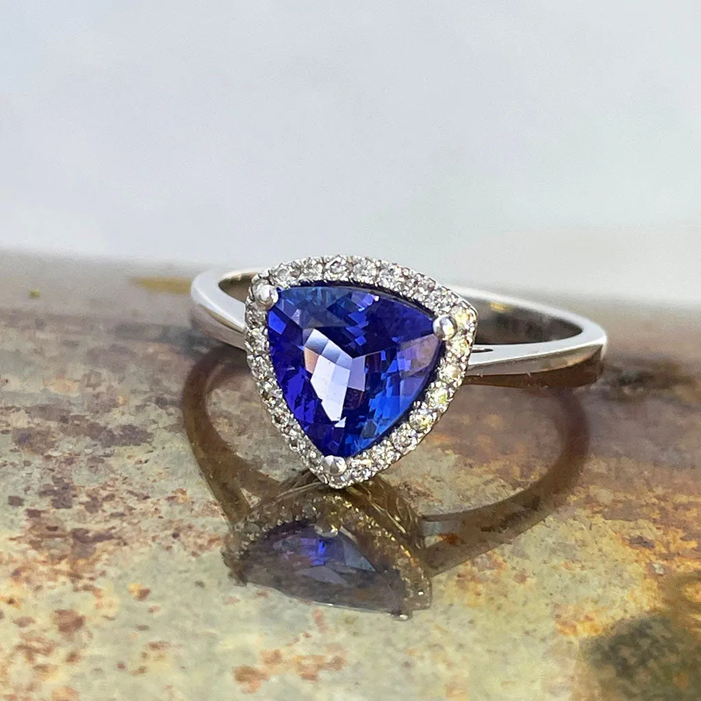 Tantalizing Trilliant Cut Tanzanite With Diamond Halo Ring