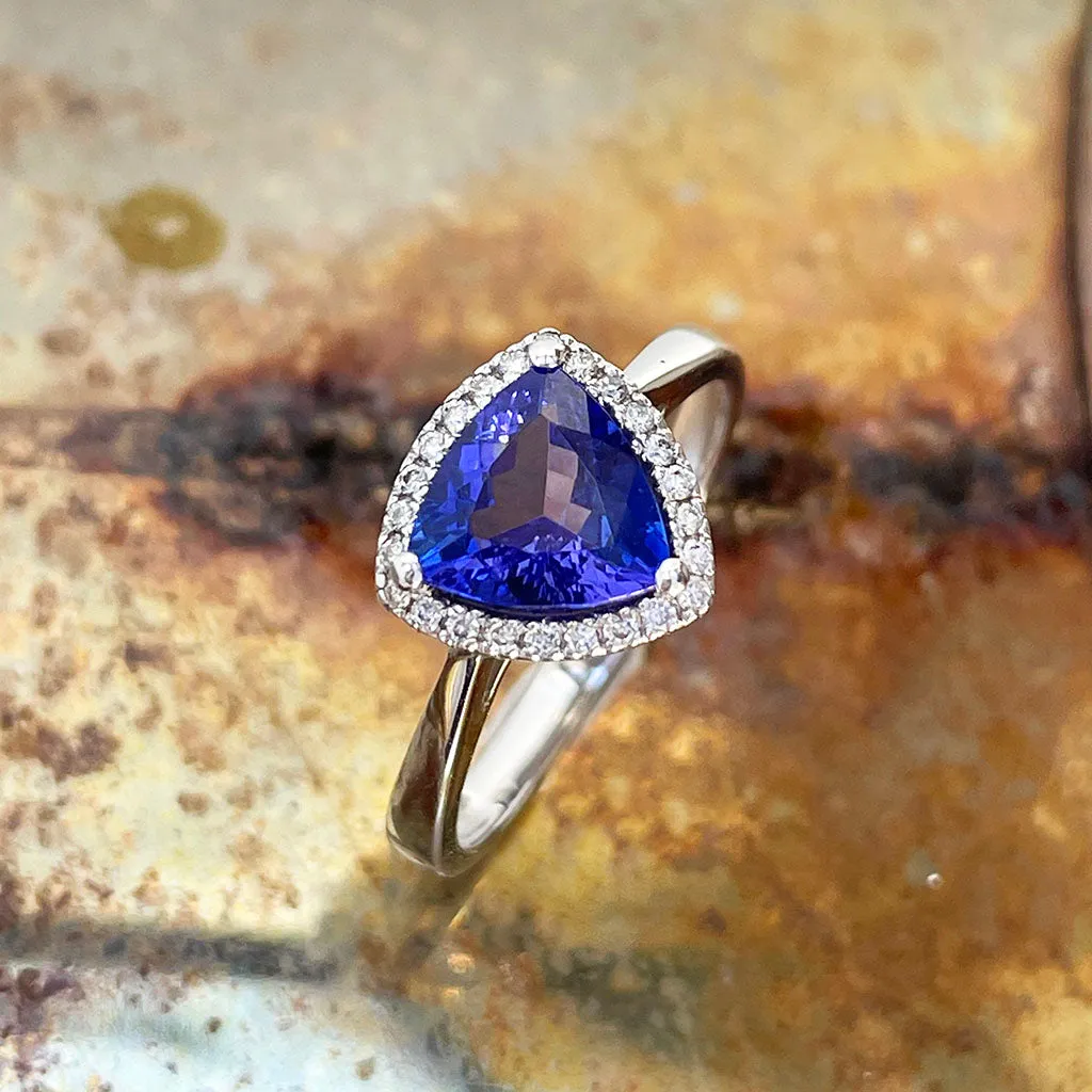 Tantalizing Trilliant Cut Tanzanite With Diamond Halo Ring