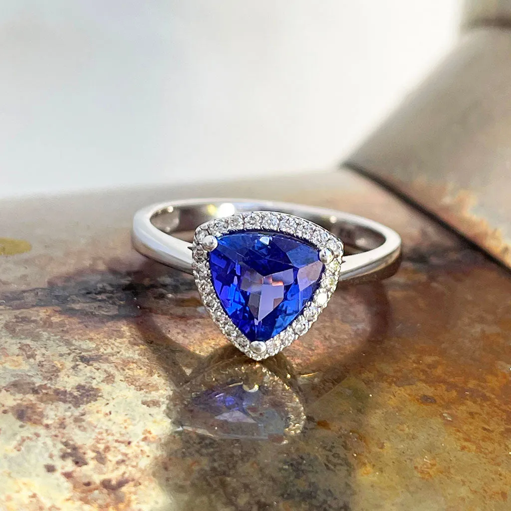 Tantalizing Trilliant Cut Tanzanite With Diamond Halo Ring